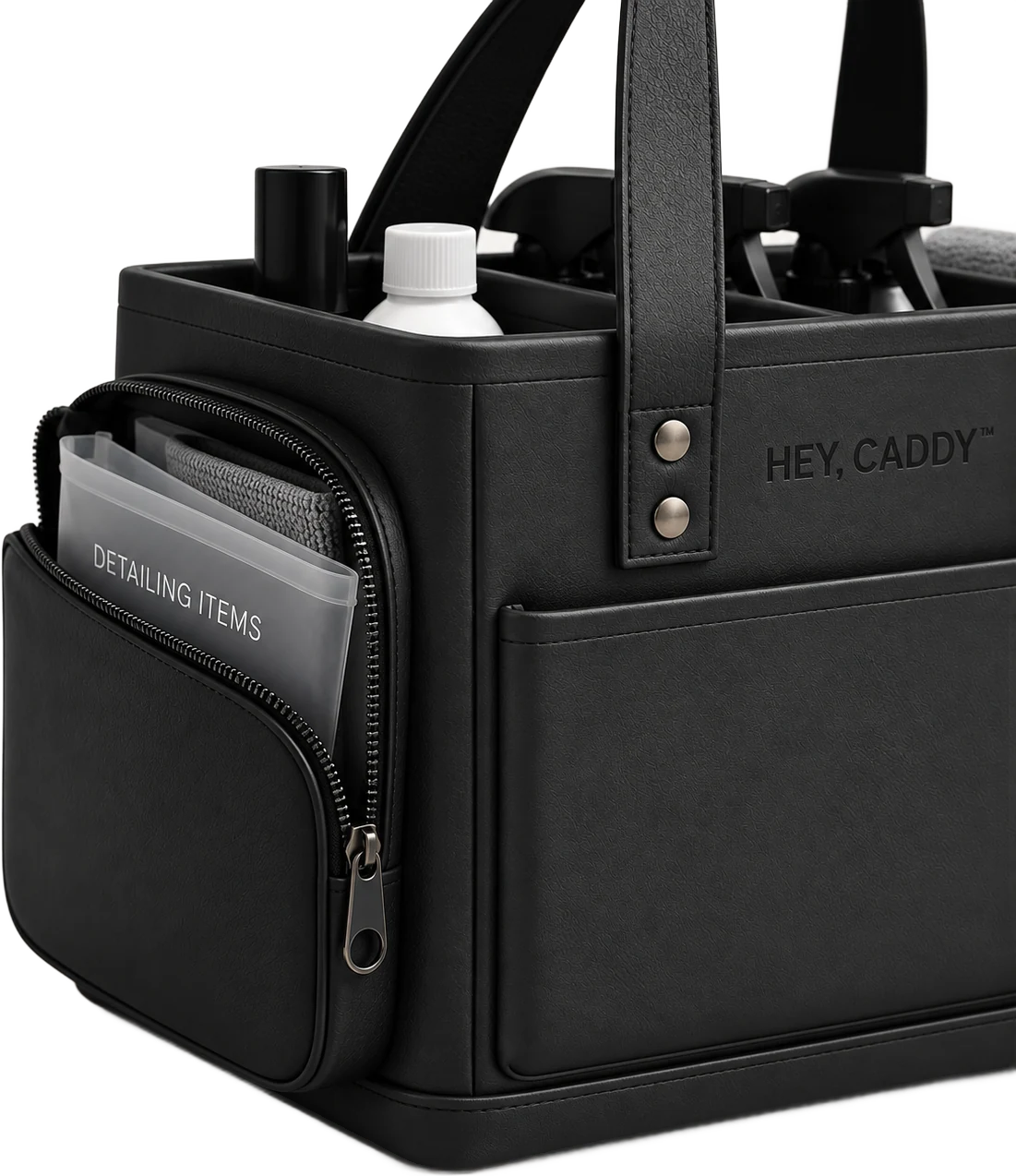 Hey, Caddy side zip pocket open, holding a detailing items pouch and a cloth